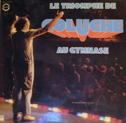 Le Triomphe De Coluche Au Gymnase by Coluche